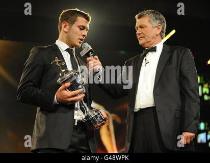 Arsenal's Jack Wilshere (left) is interviewed by Sky Sports Presenter George Gavin after he receives the PFA Young Player of the Year trophy at the PFA Player of the Year Awards 2011 at the Grosvenor House Hotel Stock Photo