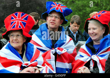 People (names not known) gather outside Buckingham Palace, London, on the morning of the royal wedding. Stock Photo