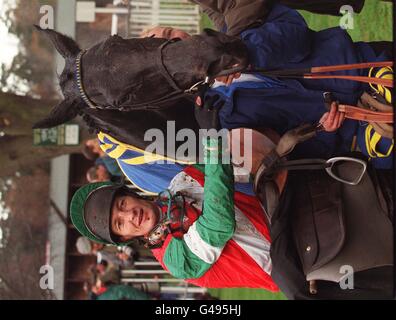 Jockey Richard Dunwoody poses with Simply Dashing in the winners enclosure at Ascot today (Saturday) following his victory in the First National Bank Gold Cup Steeple Chase. Photo by Tom Hevezi/PA Stock Photo