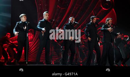 Take That perform on stage during the 2011 National Movie Awards at Wembley Arena, London Stock Photo