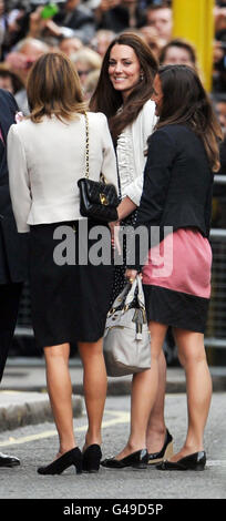 Kate Middleton (centre) arrives at the Goring Hotel, London, with her mother Carole (left) and Pippa her younger sister where the family will spend the night before Kate's wedding to Prince William at Westminster Abbey on Friday. Stock Photo