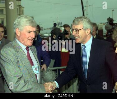 Former Prime Minister John Major (right) shakes hands with the Chairman of the Conservative Party, Cecil Parkinson on arrival to Blackpool Imperial hotel this afternoon (Monday). The Tory Party conference starts tomorrow. Photo by Adam Butler/PA*EDI* Stock Photo