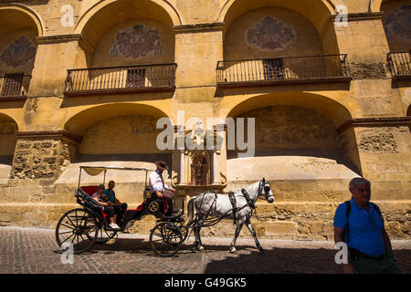 Tourist horse carriage ride. Mezquita Cathedral Arab Wall. Cordoba City Andalusia, Spain, Europe Stock Photo