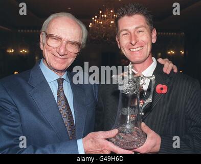 Peter O'Sullevan (left) presents Philip Sharp with the Daily Star/SIS Racing Personality of the Year award at a luncheon in London today (Tuesday). Mr Sharp was at Aintree for the Grand National and insisted on staying with the horse Suny Bay, despite the bomb warnings and evacuation of the area. Watch for PA Story. Photo by Ben Curtis/PA. Stock Photo