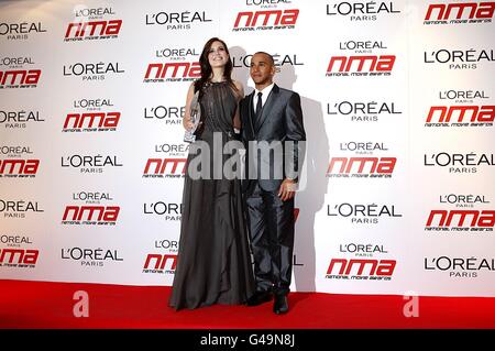 Mandy Moore and Lewis Hamilton with the award for Best Animation, at the 2011 National Movie Awards at Wembley Arena, London Stock Photo