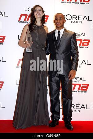 Mandy Moore and Lewis Hamilton with the award for Best Animation, at the 2011 National Movie Awards at Wembley Arena, London Stock Photo