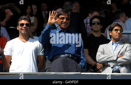 Queens Park Rangers largest shareholder Lakshmi Mittal (centre) and Vice-Chairman of QPR Holdings Limited Amit Bhatia (left) in the stands Stock Photo