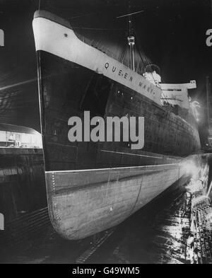 The giant Cunard-White Star liner RMS Queen Mary in the King George V dry dock at Southampton, for her annual inspection. Stock Photo