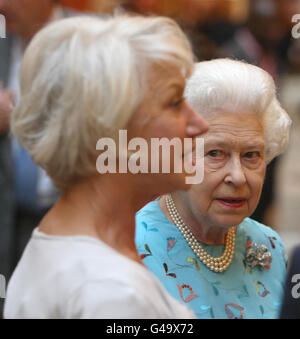 Queen Elizabeth II meets Dame Helen Mirren at a reception to celebrate young people in the performing arts, at Buckingham Palace, in central London. Stock Photo