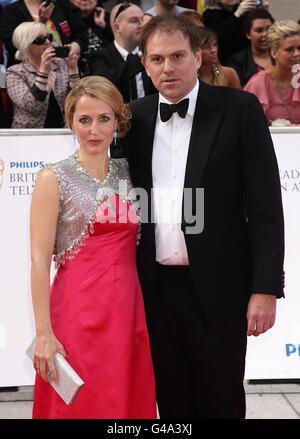 Gillian Anderson and husband Mark Griffiths arriving for the Philips British Academy Television Awards at the Grosvenor House, 90 Park Lane, London. Stock Photo