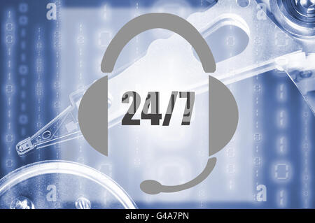Image of an headset representing the concept of 24/7 support with an hard disk drive on the background Stock Photo