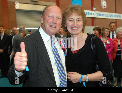 Jim Allister, Leader of the TUV, celebrates with his wife Ruth after he was elected in North Antrim without reaching the quota. The hardline unionist took a seat on the ninth count after the elimination of the SDLP's Declan O'Loan, the husband of former Police Ombudsman Nuala O'Loan. Stock Photo