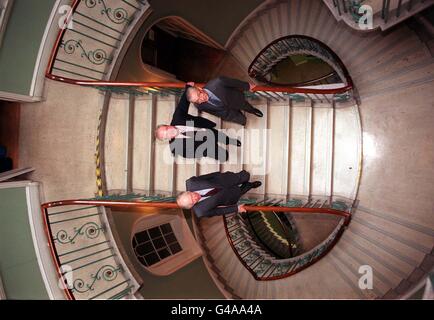 Heritage Secretary, Chris Smith, flanked by Lord Sainsbury (right) and Lord Rothschild stands on the spiral staircase in Somerset House in London today (Wednesday). Mr Smith handed over the lease for the 18th century public building to Lord Sainsbury who is Chairman of 'Somerset House Ltd' - a new charity established to take over responsibility for the building from the government. Plans for a major development programme have been announced to restore the building and open it to the public. Photo by Peter Jordan/PA Stock Photo