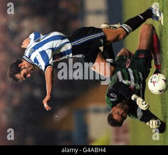 Paolo Di Canio of Sheffield Wednesday beats Barnsley goalkeeper Lars Leese to score the winning goal in their FA Carling Premiership Match tonight (Monday). Photo by John Giles/PA. Stock Photo