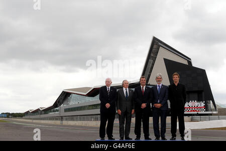 Former British Formula One world champions (from left) John Surtees, Jackie Stewart, Nigel Mansell, Damon Hill and Jenson Button during the opening of the new Silverstone Wing at the Silverstone Circuit, Northampton. Stock Photo