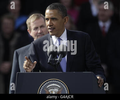 Taoiseach Enda Kenny looks on as US President Barack Obama speaks in College Green, Dublin, during his visit to Ireland at the start of a week-long tour of Europe. Stock Photo