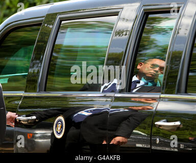 A Secret Service agent holds the door of US President Barack Obama's car, known as 'the beast' at Winfield House, the official residence of the US Ambassador, in Regent's Park, central London.