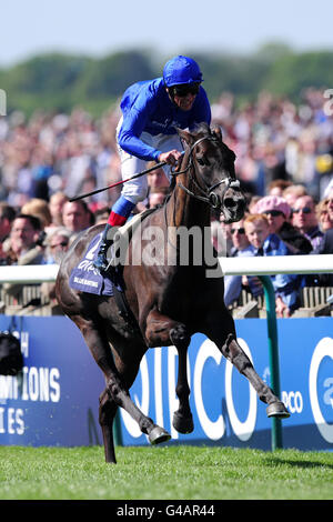 Horse Racing - The QIPCO Guineas Festival - Day Two - Newmarket Racecourse. Blue Bunting ridden by Frankie Dettori crosses the line to win the Qipco 1000 Guineas Stakes Stock Photo