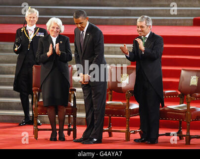 Gentleman Usher of the Black Rod Lieutenant General David Leakey (left), speaker of the House of Lords Baroness Hayman and speaker of the House of Commons John Bercow (right) applaud US President Barack Obama (centre) following his keynote speech to both Houses of Parliament in the historic Westminster Hall, previously accorded only to a handful of eminent figures like Nelson Mandela, Charles de Gaulle and the Pope. Stock Photo