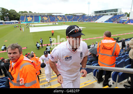 Cricket - npower First Test - Day One - England v Sri Lanka - SWALEC Stadium. England's Andrew Strauss makes his way back to the pavillion after a further pitch inspection, as rain delays the start of play Stock Photo