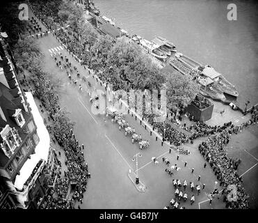 Big Ben's view of the glittering cavalcade as the State Coach, bearing the Queen to her Coronation, turns from Victoria Embankment into Bridge Street on the final approach to Westminster Abbey. Stock Photo