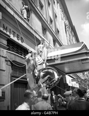 A figurehead, representing a Life Guard and the head of the horse he is riding is hoisted aloft to form part of the exterior Coronation decorations at the Cumberland Hotel, Marble Arch. Stock Photo