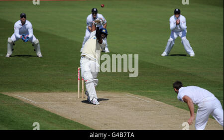 Cricket - npower First Test - Day Two - England v Sri Lanka - SWALEC Stadium. Sri Lanka's Thisara Perera hits the ball back over the head of England bowler Chris Tremlett. Stock Photo