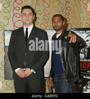 Director of the film Reg Traviss (left) and Noel Clarke arriving for the premiere of Screwed, at The Soho Hotel in central London. Stock Photo