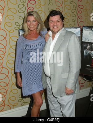 Jamie Foreman and his wife Julie Dennis arriving for the premiere of Screwed, at The Soho Hotel in central London. Stock Photo