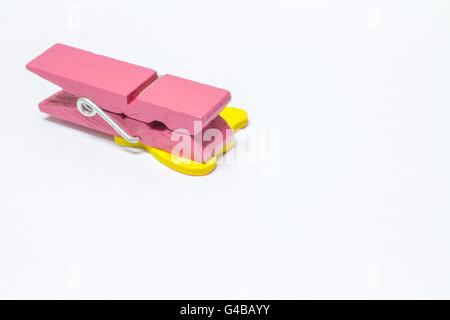 pink color wood peg on white background Stock Photo