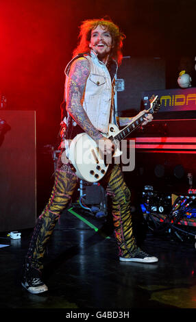 Justin Hawkins of The Darkness performs on stage at the O2 Shepherd's Bush Empire in west London, the band's first show in London after reuniting. Stock Photo