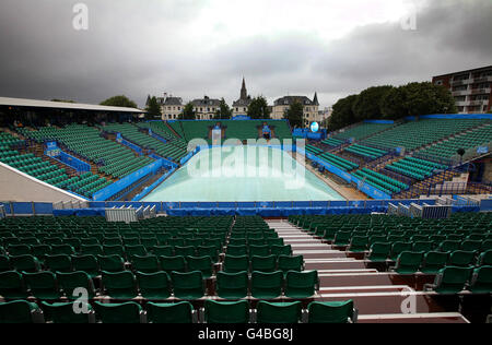 A general view of Centre Court with the covers on as rain falls during the AEGON International at Devonshire Park, Eastbourne. Stock Photo