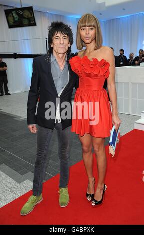 Ronnie Wood and girlfriend Ana Araujo arriving for the World Premiere of Larry Crowne, at the Westfield Shopping Centre, White City, London. Stock Photo