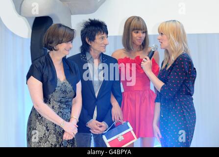 Edith Bowman talks to Ronnie Wood and girlfriend Ana Araujo with Cherie Blair as they arrive for the World Premiere of Larry Crowne, at the Westfield Shopping Centre, White City, London. Stock Photo