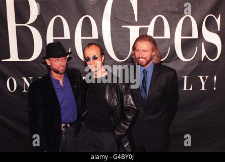 The Bee Gess (from left) Maurice, Robin and Barry Gibb pose for the media during a photocall at London's Cafe Royal today (Tuesday) where they unveiled plans for a leisurely world tour, 31 years after their first hit. Photo by Andrew Stuart/PA. See PA story SHOWBIZ Bee Gees Stock Photo