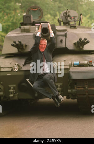 SIR COLIN CHANDLER, CHIEF EXECUTIVE OF VICKERS PLC, SHOWS HIS PLEASURE AFTER TAKING THE WRAPS OFF THE CHALLENGER 2 TANK AT CHELSEA BARRACKS IN LONDON. * 20/9/99 It was announced that aero-engines company Rolls-Royce had made an agreed cash offer of 576 million for the Vickers engineering group. As well as defence systems, Vickers also has marine and turbine divisions. Stock Photo