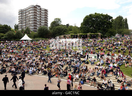 Fans watch the action on Centre Court from Murray Mount on day four of the 2011 Wimbledon Championships at the All England Lawn Tennis and Croquet Club, Wimbledon. Stock Photo