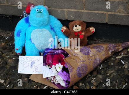 Tributes left at the scene at Lindsey Mount flats in Leeds, where a 6-year-old boy fell to his death yesterday. Stock Photo