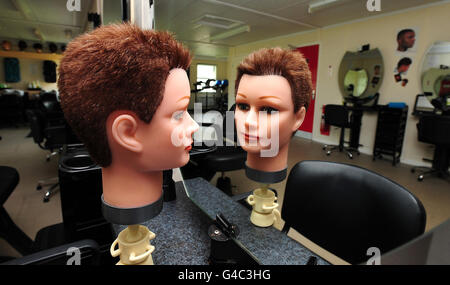 General view of a hairdressers model head where detainees learn hairdressing and barber skills at Morton Hall Immigration Removal Centre, near, Swinderby, Lincolnshire. Stock Photo