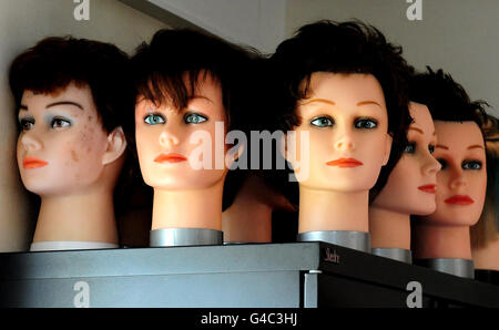 General view of hairdressers model heads on which detainees learn hairdressing and barber skills at Morton Hall Immigration Removal Centre, near, Swinderby, Lincolnshire. Stock Photo