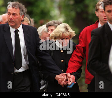 The family of murdered nurse Vickie Fletcher hold hands as they follow ...