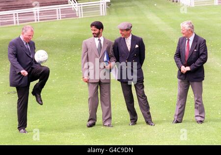 Former soccer player turned race horse trainer Mick Channon (far left) attempts to get fellow trainers (left to right) Saeed Bin Suroor, Ben Hanbury and David Elsworthy get into the spirit of the 1998 World Cup as they inspect the course and new facilities at Royal Ascot today (Tuesday). Photo by Andrew Stewart/PA