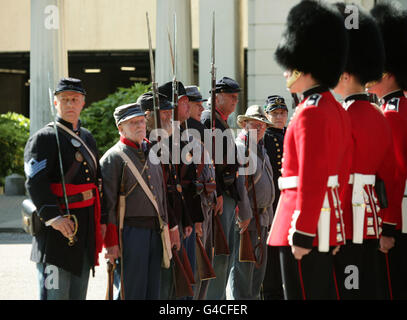 Members of The Southern Skirmish Association (SoSkAn) American Civil War Re-enactment Society with soldiers from the Grenadier Guards, during the launch of The British Military Tournament at Wellington Barracks in central London. Stock Photo