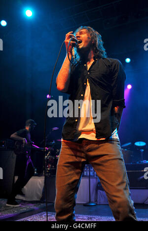 Brandon Boyd and Ben Kenney (left) of Incubus perform on stage at the HMV Forum in north London. Stock Photo