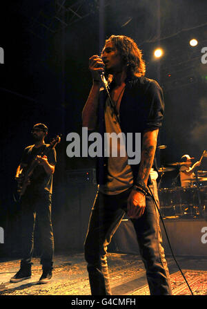 Brandon Boyd and Ben Kenney (left) of Incubus perform on stage at the HMV Forum in north London. Stock Photo