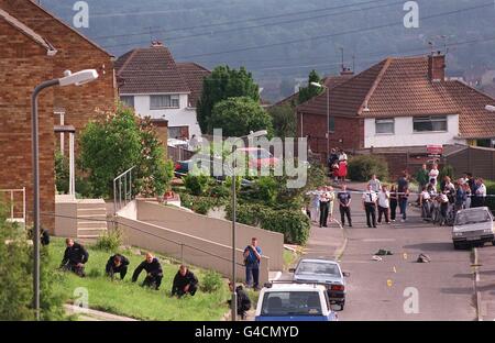 Police conduct a search following a vicious street fight between two families which left eight men in hospital with stab wounds. Police arrested 20 people, after knives, sticks, baseball bats and axes were used during the two-hour long fight among Asians in a quiet residential street of High Wycombe, Bucks. See PA story CRIME Stab. Photo by Rosie Hallam/PA Stock Photo