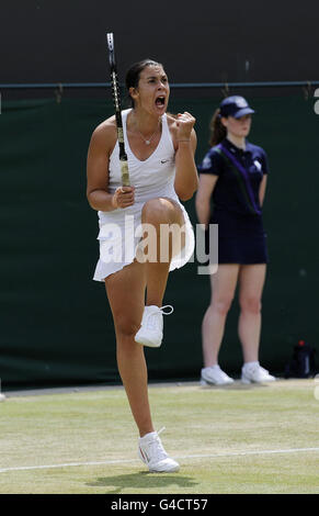 France's Marion Bartoli celebrates against Spain's Lourdes Dominguez Lino during day five of the 2011 Wimbledon Championships at the All England Lawn Tennis and Croquet Club, Wimbledon. Stock Photo