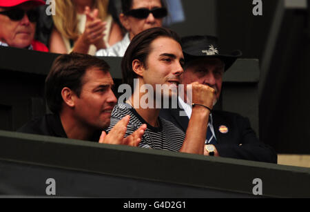 Maria Sharapova's fiance Sasha Vujacic celebrates as he watches her match against Germany's Sabine Lisicki on day ten of the 2011 Wimbledon Championships at the All England Lawn Tennis and Croquet Club, Wimbledon. Stock Photo