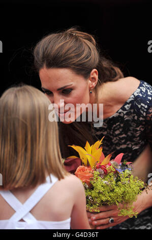 The Duchess of Cambridge receives flowers from Sophie Graydon outside the official residence of the Governor General of Canada, Rideau Hall in Ottawa, on the first day of her visit to the Commonwealth country. Stock Photo