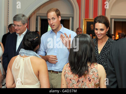 The Duke and Duchess of Cambridge, with Canadian Prime Minister Stephen Harper, during an informal reception for young Canadian volunteers in the official residence of the Governor General of Canada, Rideau Hall in Ottawa, on the first day of their visit to the Commonwealth country. Stock Photo